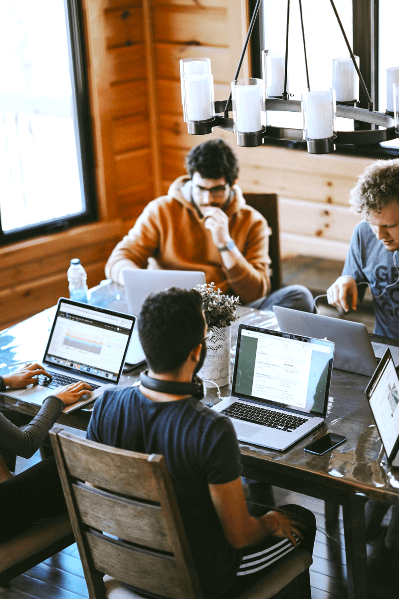 Students collaborating on laptops